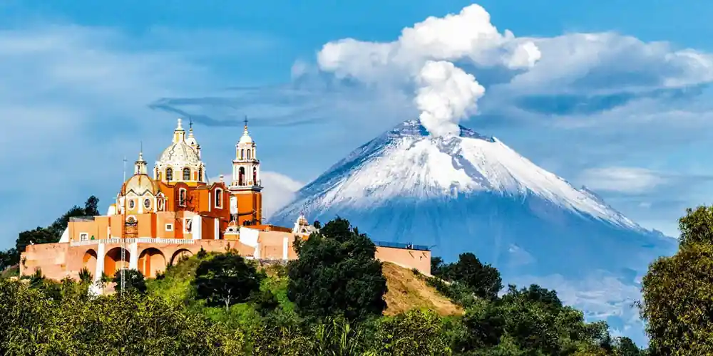 Church of Nuestra Señora de los Remedios in Cholula with Popocatépetl volcano