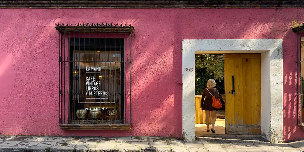 Coyoacán sits south of Centro, organized around plazas, markets, and slower residential streets