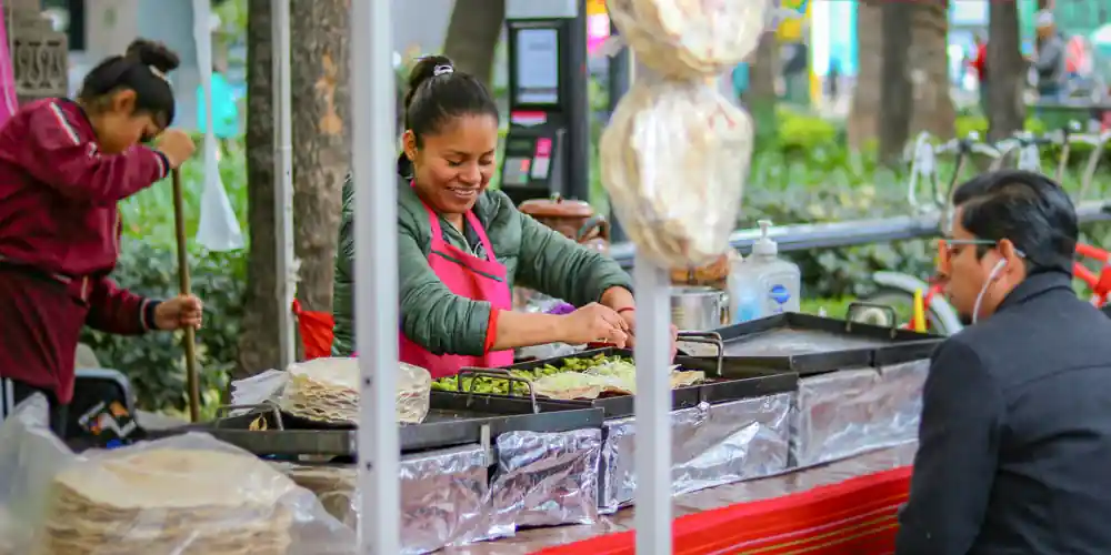 Street food vendor preparing tacos in Mexico City's Historic Center