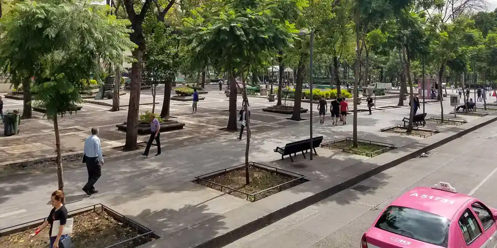 People walking through Alameda Central in Mexico City