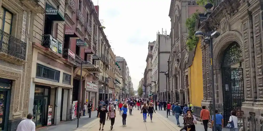 People walking along Calle Madero in Centro Histórico, Mexico City