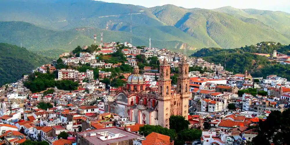 View across Taxco toward the Santa Prisca Church and the surrounding mountains