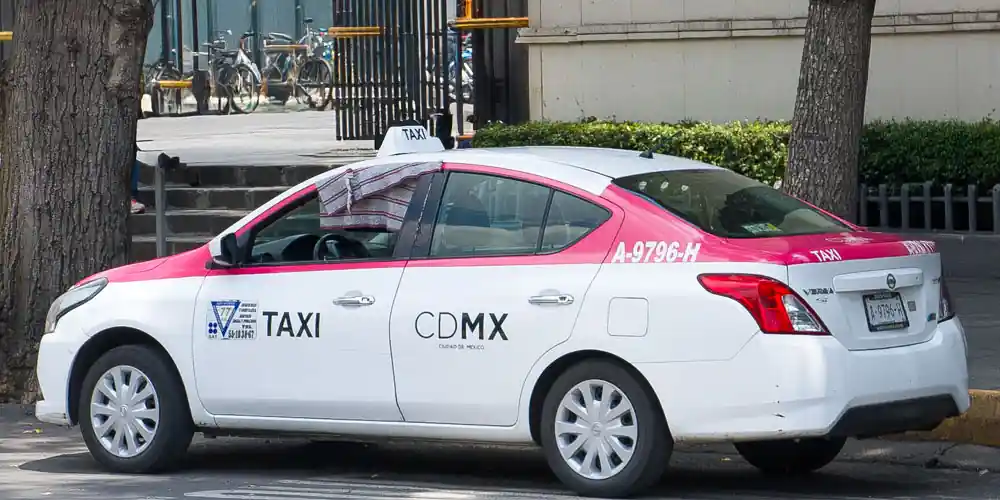 Official Mexico City taxi waiting at the curb