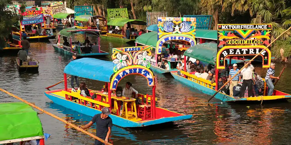 Colorful trajineras on the canals of Xochimilco in Mexico City